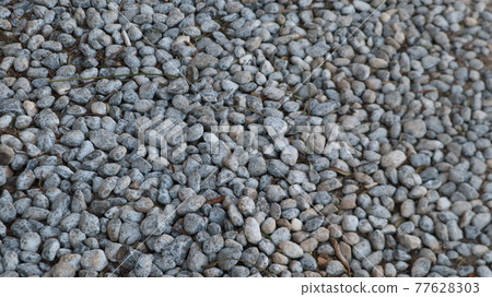 Texture of little stones in many shades of grey and white laying on ground. Stone floor texture for background. Crack Stone pattern at a construction site in Turkey Texture of little stones in many shades of grey and white laying on ground. Stone floor texture for background. Crack Stone pattern at a construction site in Turkey 77628303