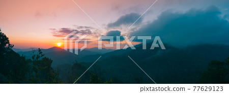 Panoramic mountain landscape. Majestic sunrise of the mountains layer in the morning. Serenity Panoramic mountain landscape. Majestic sunrise of the mountains layer in the morning. Serenity 77629123