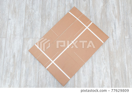Packed boxes with furniture on the floor in an apartment. Top view Packed boxes with furniture on the floor in an apartment. Top view 77629809