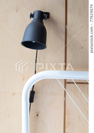 The lamp above the bed. Bedside lamp for reading. Lampshades The lamp above the bed. Bedside lamp for reading. Lampshades 77629874