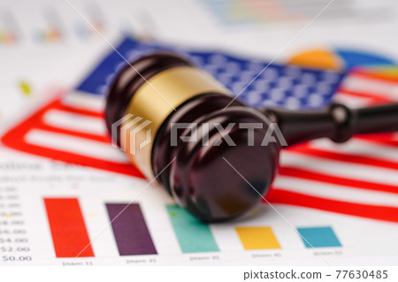 Gavel for judge lawyer and United States of America USA flag on chart graph paper 77630485