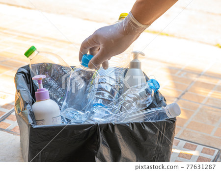 Woman holding plastic bottles garbage in box to reuse recycle for good environment. Woman holding plastic bottles garbage in box to reuse recycle for good environment. 77631287
