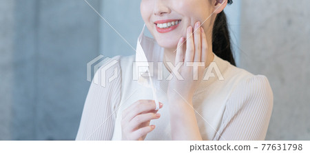 A young woman who smiles with her mask on her ear Banner size A young woman who smiles with her mask on her ear Banner size 77631798