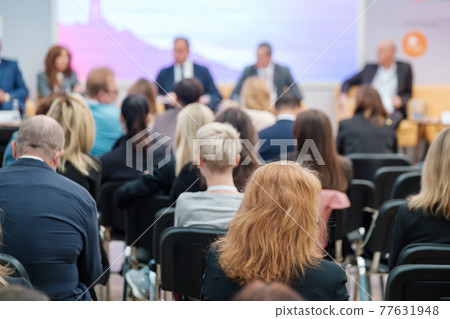 Speakers discussing business problems in auditorium 77631948