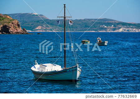 Traditional greek fishing boat in the aegean sea, Greece. Traditional greek fishing boat in the aegean sea, Greece. 77632669