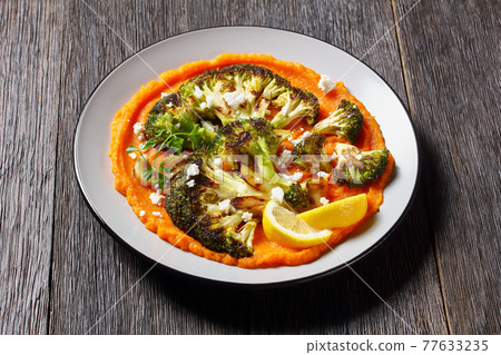 grilled broccoli steaks with puree and feta grilled broccoli steaks with puree and feta 77633235