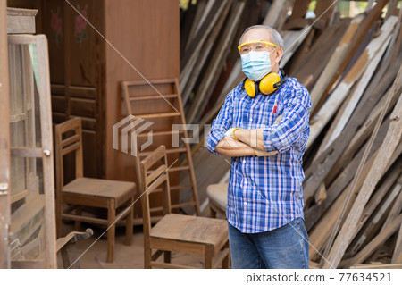 Portrait of elder wood worker hobby for good retirement, Asian male mature professional master of wood craft furniture wooden maker man. Portrait of elder wood worker hobby for good retirement, Asian male mature professional master of wood craft furniture wooden maker man. 77634521