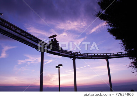 Amusement park at dusk Amusement park at dusk 77634906