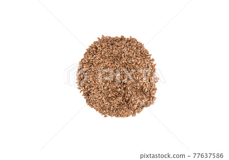 Heap of flax seeds isolated on white background. Heap of flax seeds isolated on white background. 77637586
