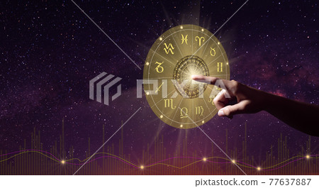Human predicts the future. Zodiac sign wheel of fortune hologram with mandala inside. The Milky way and life graph background. Copy space. 77637887