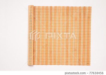 Bamboo mat on a white background Bamboo mat on a white background 77638456