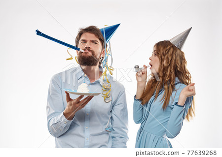 birthday party disco young people with cake and columns fun cropped view close-up 77639268