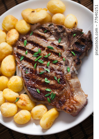 Grilled Beefsteak with Baby Roasted Potatoes. High quality photo. Grilled Beefsteak with Baby Roasted Potatoes. High quality photo. 77640251
