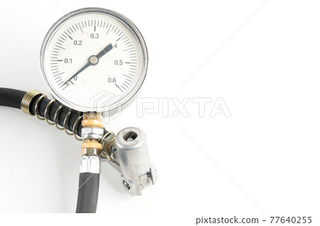 Pressure gauge for measuring air pressure in car tires on a white background 77640255
