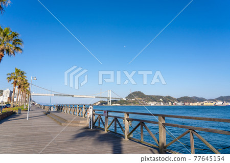 Shimonoseki City, Yamaguchi Prefecture, a deck of a promenade overlooking the Kanmon Bridge and the Kanmon Strait 77645154