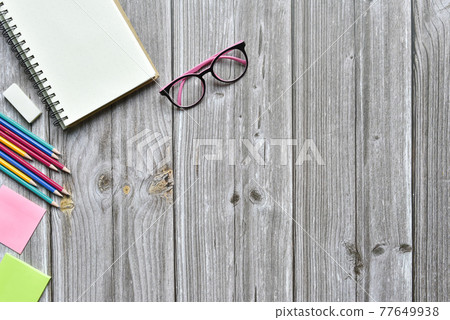 Still life, business office supplies or education concept, Top view image of open notebook and various colorful pencil and eyeglasses with blank pages on old brown wooden, ready for adding text Still life, business office supplies or education concept, Top view image of open notebook and various colorful pencil and eyeglasses with blank pages on old brown wooden, ready for adding text 77649938