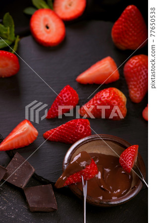 Flat lay composition with chocolate covered strawberries on grey background 77650538