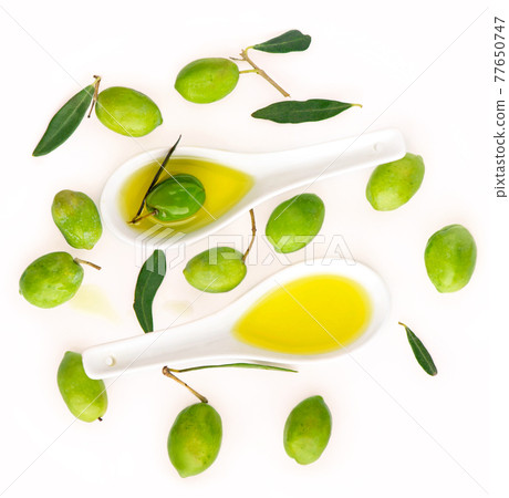 Olive fruit and olive leaves on a white background Olive fruit and olive leaves on a white background 77650747