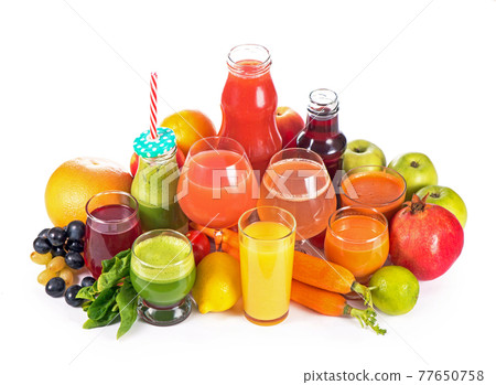 Glasses with various fresh vegetable juices on white Glasses with various fresh vegetable juices on white 77650758