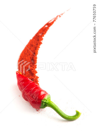 Red hot chilies with powder over white background Red hot chilies with powder over white background 77650759