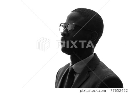 Black man silhouette looking up Black man silhouette looking up 77652432