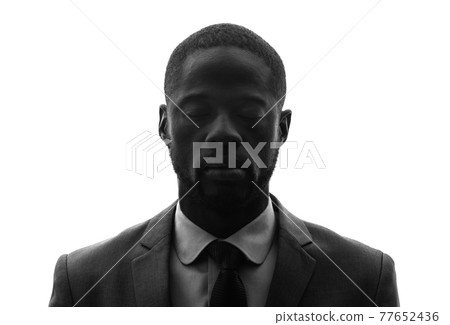 Black man silhouette with closed eyes 77652436