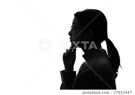 Profile silhouette of an Asian woman 77652447