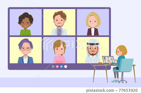 A set of women in a hoodie having a video chat with multiple people A set of women in a hoodie having a video chat with multiple people 77653920