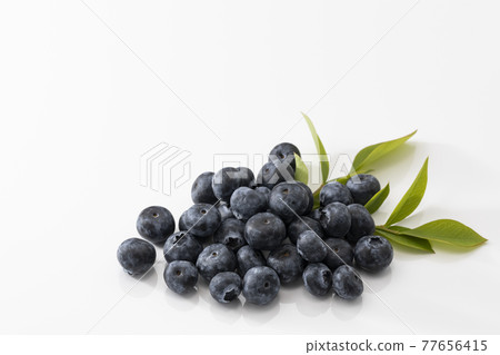 White background blueberries with leaves 77656415