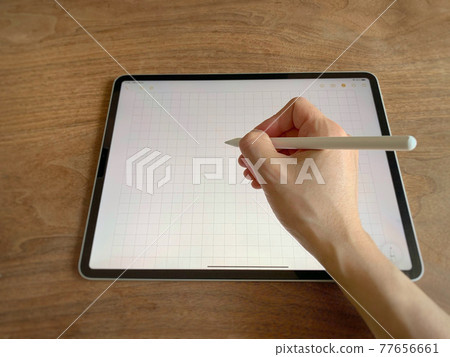 Right hand writing on tablet with touch pen 77656661