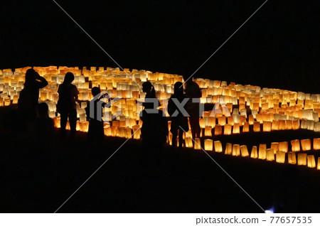 The silhouette of the person at the Torch Festival 77657535