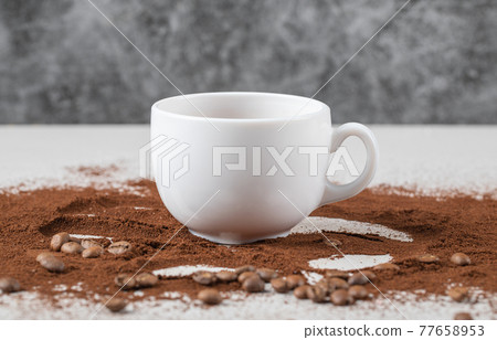 A cup of drink on the blended coffee powder A cup of drink on the blended coffee powder 77658953