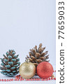 Christmas tree balls and oak cones with red pearl chain on the white background 77659033