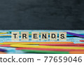 Trends writing with black letters on wooden dices on the blue background 77659046