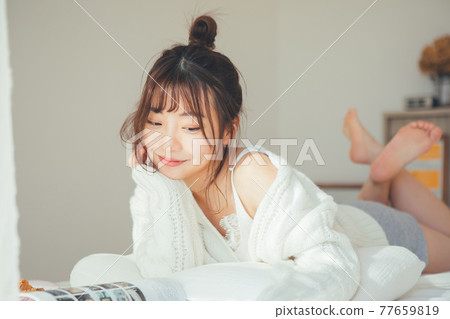 Girl relaxing in the room Girl relaxing in the room 77659819