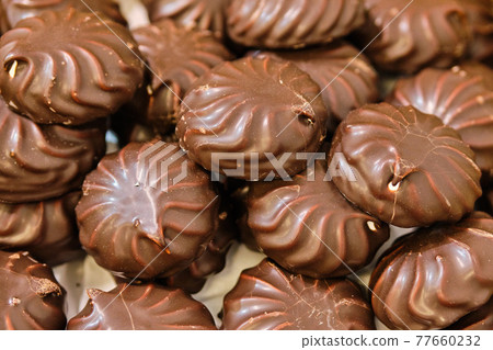 Background and texture of chocolate marshmallows sweets. Background and texture of chocolate marshmallows sweets. 77660232