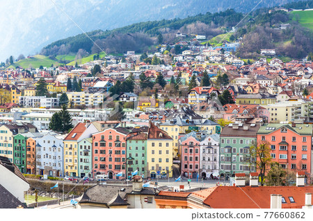 Aerial view of colorful buildings and mountains of Innsbruck, Austria 77660862