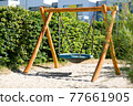 round children's swing in the Park 77661905