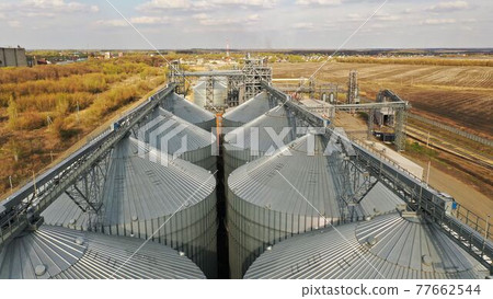 Aerial view of grain storage elevators. Grain storage. Grain storage elevator in the USA. Aerial view of grain storage elevators. Grain storage. Grain storage elevator in the USA. 77662544