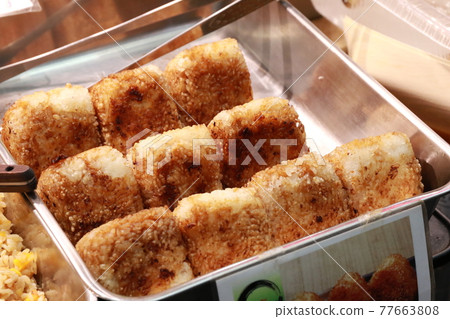 "Yaki Onigiri" sold at the Kuromon Market in Nipponbashi, Osaka 77663808
