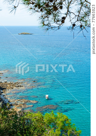 View to the Cyprus island sea coast with blue water and mountain. Akamas cape landscape 77663823
