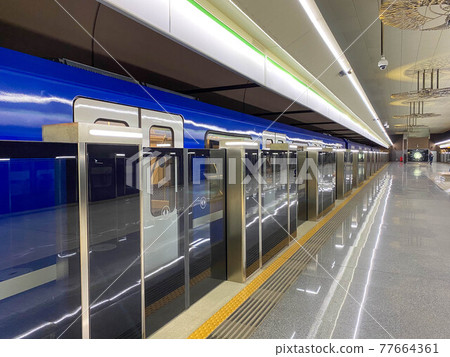 New blue modern subway train high speed fast safe in the big city on the waiting platform at the subway station at the train station 77664361