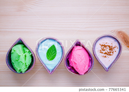 Alternative skin care and homemade scrubs set up on wooden table. 77665341