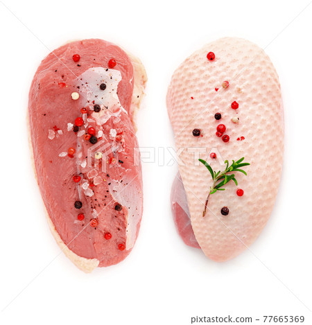 Raw duck breast fillet  with rosemary and spices  isolated on white Background. 77665369