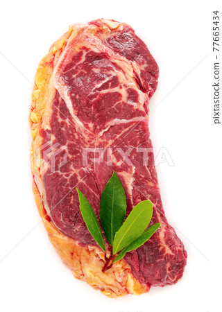 Raw strip loin steak isolate on white  background. Flatlay of fresh raw beef steak isolated on white background top view. 77665434