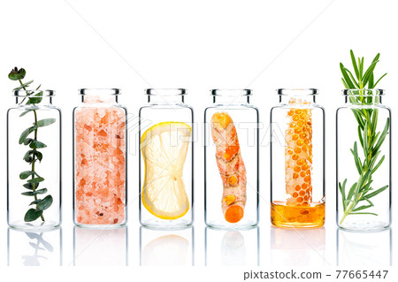Alternative skin care and homemade scrubs with natural ingredients  in glass bottles isolate on white background. 77665447