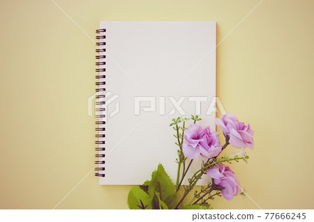 Spiral Notebook and Purple Flower on Minimalist Background in Vintage Tone Spiral Notebook and Purple Flower on Minimalist Background in Vintage Tone 77666245