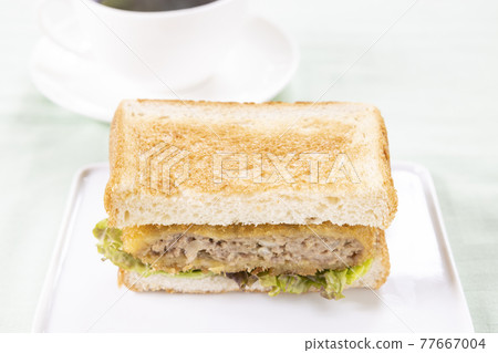 Delicious Menchi-katsu sandwich and hot coffee 77667004