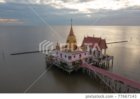 Aerial view of Wat Hong Thong with lake or sea, Chachoengsao near Bangkok City, Thailand. Thai buddhist temple architecture. Tourist attraction. 77667143