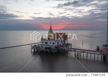 Aerial view of Wat Hong Thong with lake or sea, Chachoengsao near Bangkok City, Thailand. Thai buddhist temple architecture. Tourist attraction. 77667145